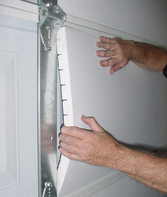 Installing garage door insulation and repair in Ypsilanti Michigan